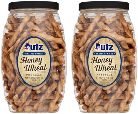 Two 24 oz braided-twist pretzel barrels standing side by side, front labels facing camera, on a clean white field